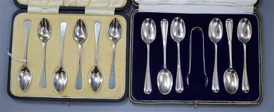 Two cased sets of six silver teaspoons including one with tongs and one early 20th century with enamel.